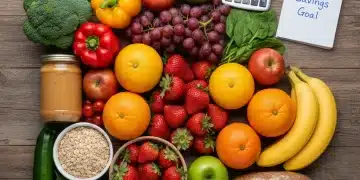 Colorful arrangement of fresh groceries and a calculator symbolizing food budget savings.