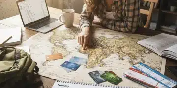 Traveler planning trip with credit cards and map for Q1 2026